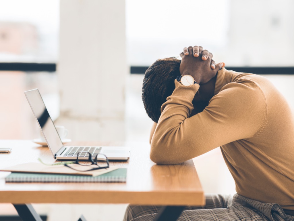 exhausted-african-american-manager-feeling-sad-and-desperate